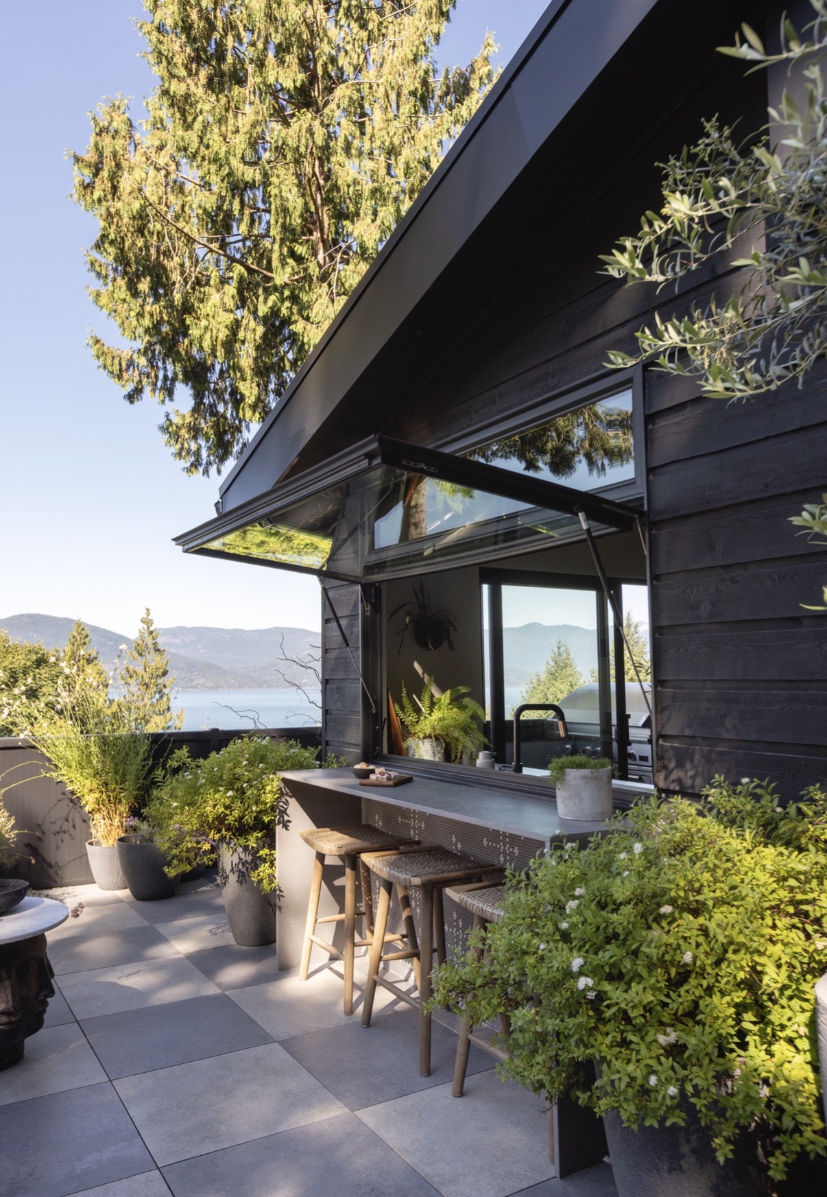 Exterior renovation, new deck, custom bistro window and bar.