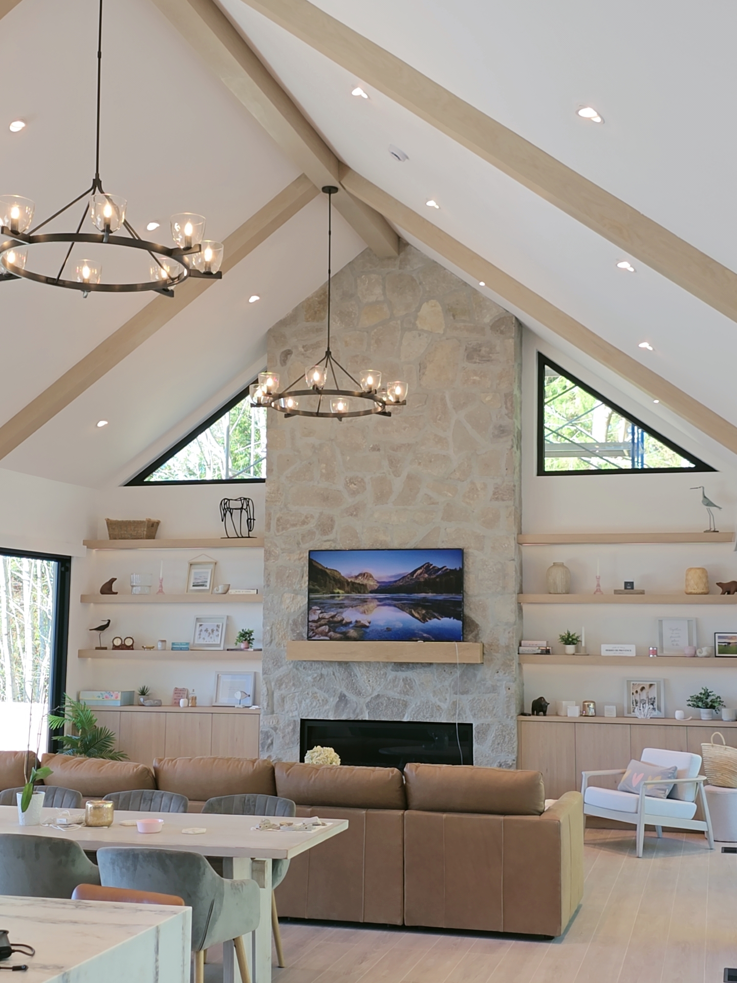 Vaulted Great Room with White Oak Shelving and Fireplace Mantel"
